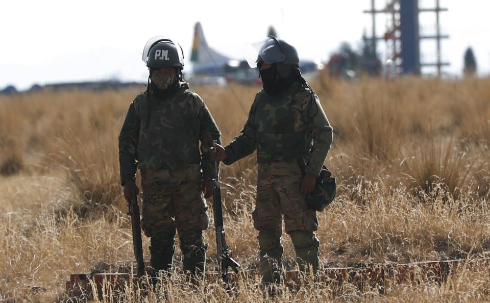 Military Police guard the grounds of the International Airport of El Alto, Bolivia, Wednesday, Aug. 12, 2020. Demonstrators announced Wednesday that they would take over the airport as they protested against the postponement of the presidential election. (AP Photo/Juan Karita)