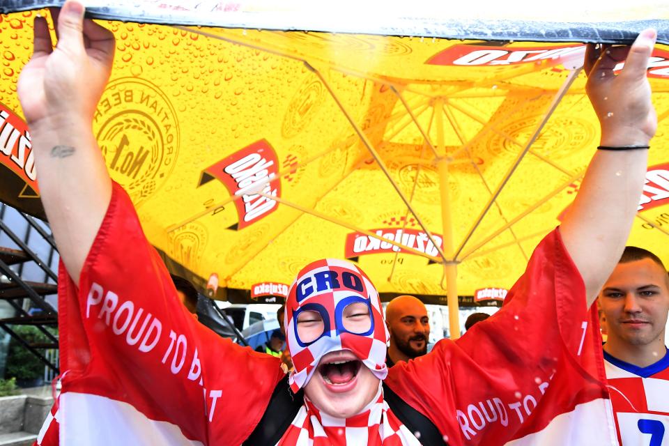 <p>A supporter of Croatia’s national football team poses for a picture in downtown Zagreb, a few hours prior to the Russia 2018 World Cup final football between France and Croatia, on July 15, 2018. (Getty Images) </p>