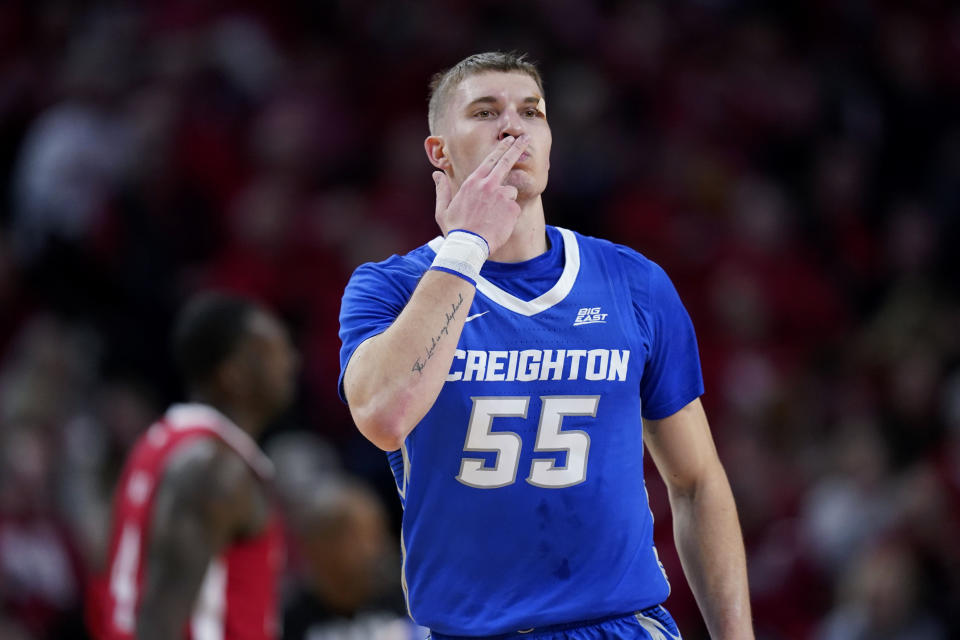 Creighton guard Baylor Scheierman (55) celebrates after making a 3-point basket during the first half of an NCAA college basketball game against Nebraska, Sunday, Dec. 3, 2023, in Lincoln, Neb. (AP Photo/Charlie Neibergall)