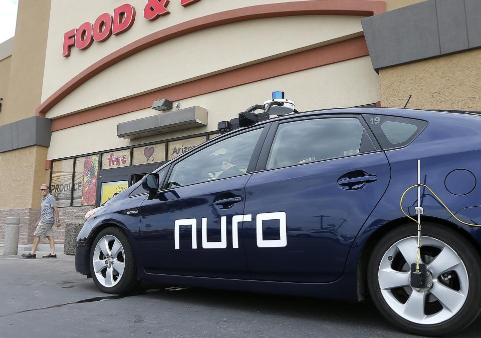 FILE - This Aug. 16, 2018 file photo shows a self-driving Nuro vehicle in Scottsdale, Ariz. CVS Health said Thursday, May 28, 2020 it will partner with Silicon Valley robotics company Nuro on deliveries of medicines and other products to customers near a Houston-area store. (AP Photo/Ross D. Franklin, File)