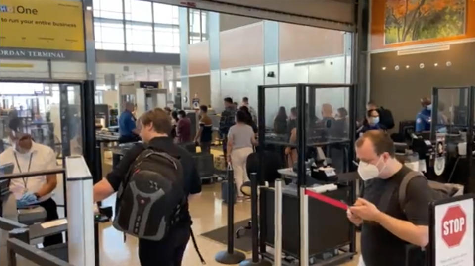 Travelers line up at a TSA screening area at Austin-Bergstrom International Airport in Austin, Texas on Wednesday, Sept. 7, 2022. An early morning power outage at the airport caused flight delays that continued even after electricity was restored. The airport reported it lost power shortly before 5 a.m., and soon after said flights had been stopped. The lights were back on by 8 a.m., but airport officials told passengers that flights would be delayed. (Austin-Bergstrom International Airport via AP)