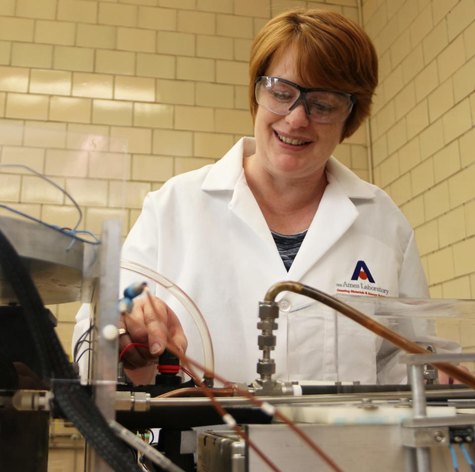 Julie Slaughter, a scientist at Ames National Laboratory, makes adjustments to CaloriSMART, a mechanism used to test materials for a magnetic refrigeration system. Magnetic refrigeration systems could potentially reduce the cost of cooling by as much as one third, and is more environmentally friendly than current gas compression refrigeration technology.  Iowa State Fair visitors will be able to see CaloriSMART in action at the Iowa State University booth in the Varied Industries Building.