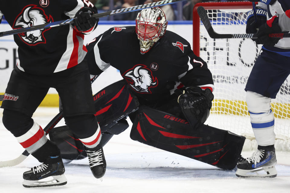 Buffalo Sabres goaltender Ukko-Pekka Luukkonen looks for the puck in during the second period of an NHL hockey game against the Winnipeg Jets, Sunday, March 3, 2024, in Buffalo, N.Y. (AP Photo/Jeffrey T. Barnes)