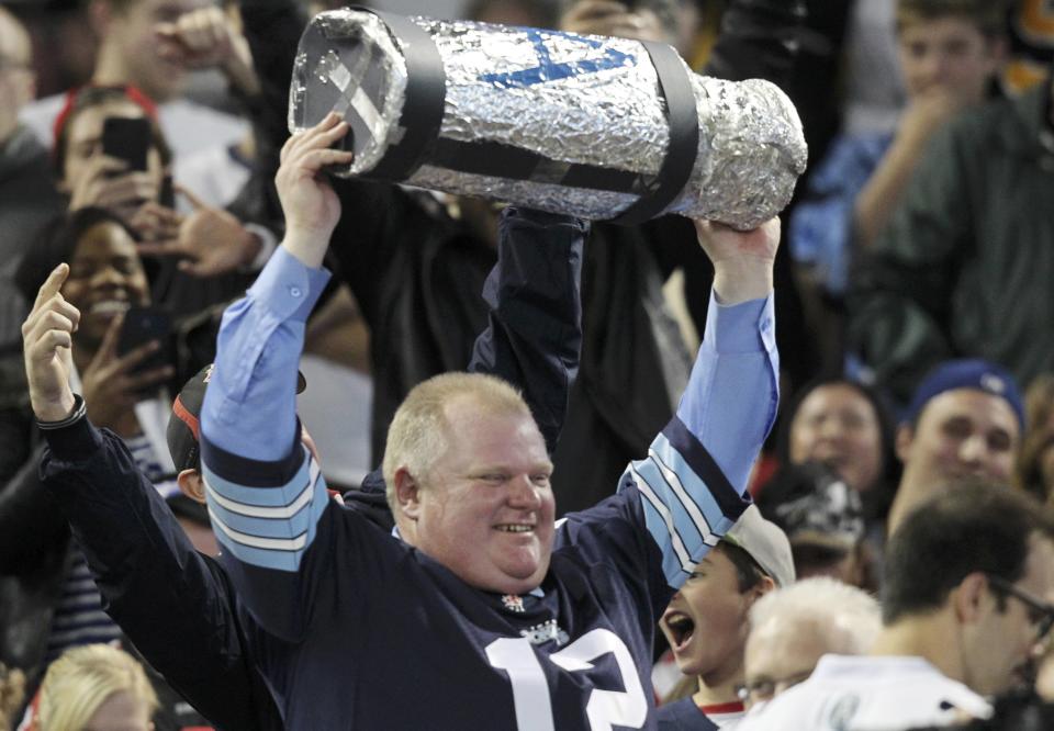 Toronto Mayor Rob Ford watches the CFL eastern final football game between the Toronto Argonauts and the Hamilton Tiger Cats in Toronto, November 17, 2013. REUTERS/Fred Thornhill (CANADA - Tags: SPORT FOOTBALL)