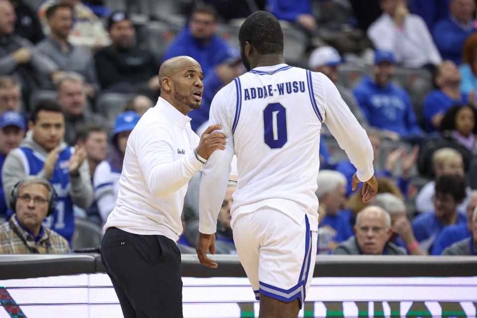 Jan 6, 2024; Newark, New Jersey, USA; Seton Hall Pirates head coach Shaheen Holloway talks with guard Dylan Addae-Wusu (0) during the first half against the Marquette Golden Eagles at Prudential Center. Mandatory Credit: Vincent Carchietta-USA TODAY Sports