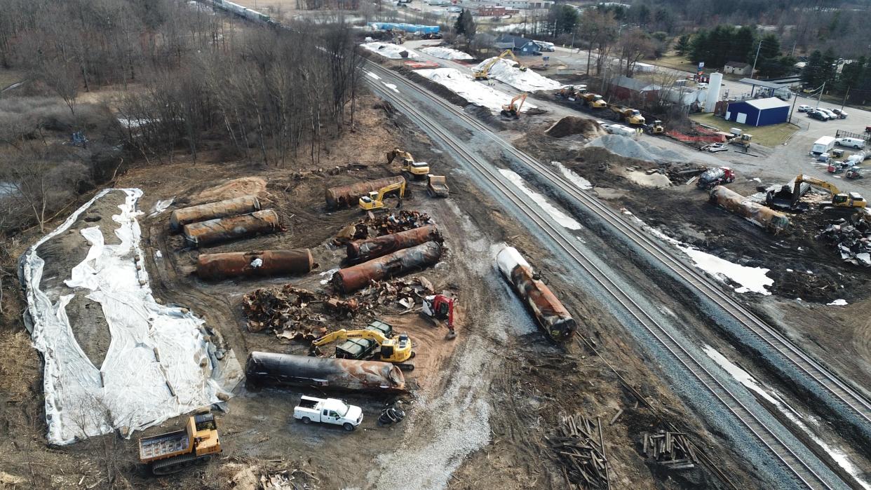 As cleanup continues on Saturday, Feb. 25, 2023, crews work at the site of the East Palestine, Ohio Norfolk Southern train derailment that released hazardous chemicals into the town's ground and water. Norfolk Southern said that 15,000 pounds of contaminated soil and 1.1 million gallons of contaminated water excavated from the derailment site will be transported to landfills and disposal facilities designed "to accept it safely in accordance with state and federal regulations."