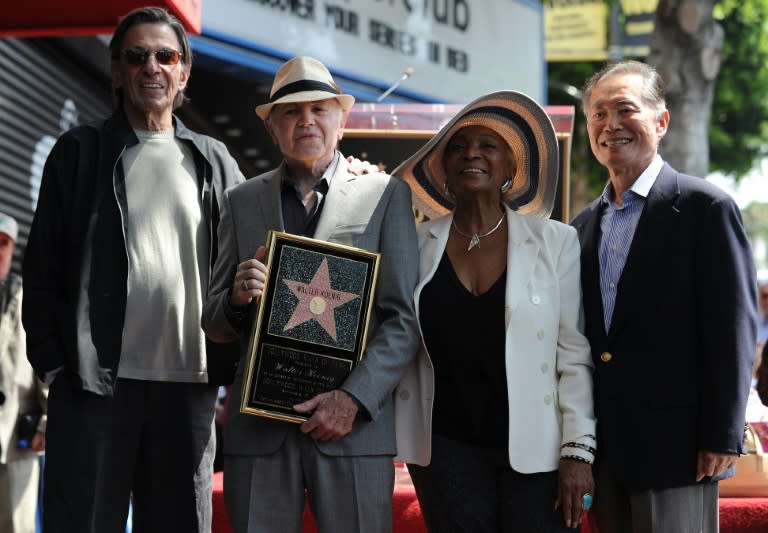 Stars of the original "Star Trek", Leonard Nimoy (L), Nichelle Nichols (2R) and George Takei (R) pose with actor Walter Koenig (2L) as he is honored with a star on the Hollywood Walk of Fame
