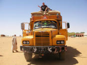 Hitching a lift on a cargo truck in Egypt. (Caters News)