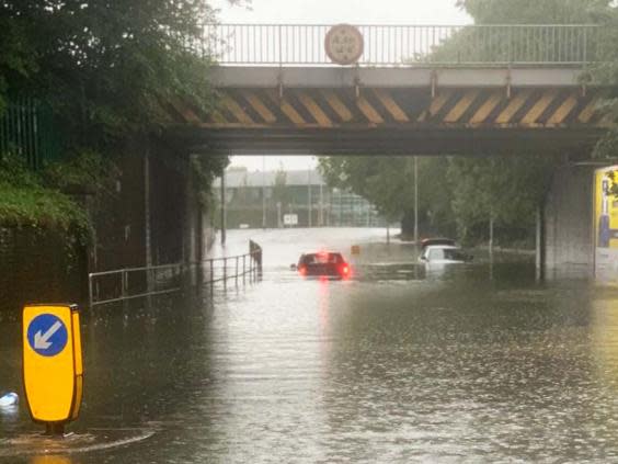 Vehicles stuck in several feet of water after flooding in Stockport, Manchester (PA / @cfbcity)