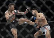 Germany's Nasrat Haqparast, right, grapples with Brazil's Joaquim Silva during the first round of a lightweight mixed martial arts bout at UFC Fight Night Saturday, Aug. 3, 2019, in Newark, N.J. Haqparast stopped Silva in the second round. (AP Photo/Frank Franklin II)