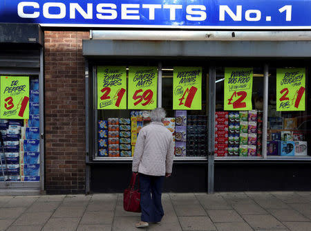 A person looks in a shop window in Consett, Britain, September 30, 2016. REUTERS/Scott Heppell