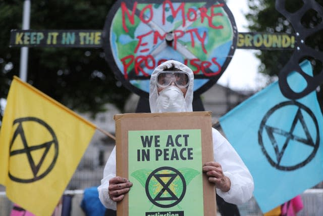 Extinction Rebellion protestors holding signs