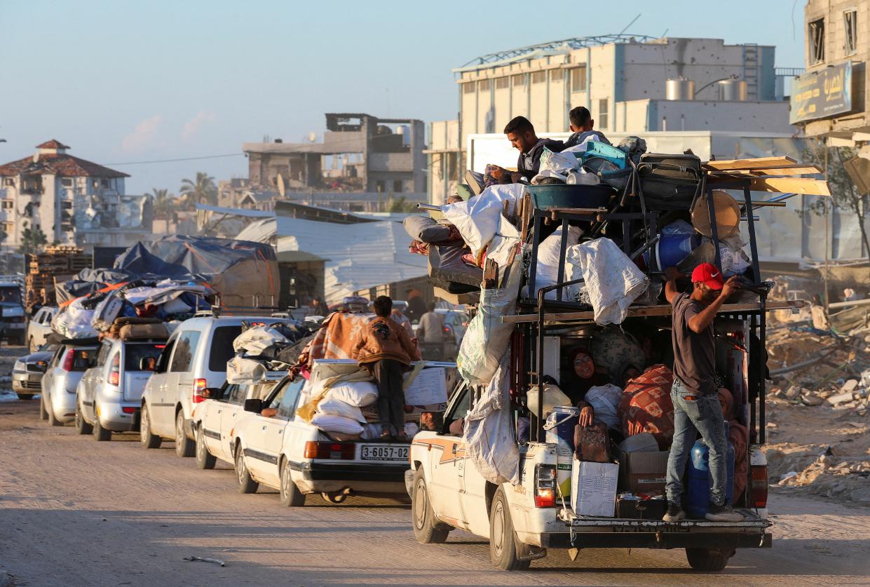 Displaced Palestinians, who fled Rafah after the Israeli military began evacuating civilians from the eastern parts of the southern Gazan city, ahead of a threatened assault, amid the ongoing conflict between Israel and Hamas, travel on a vehicle, in Khan Younis in the southern Gaza Strip 6 May  2024 (Reuters)