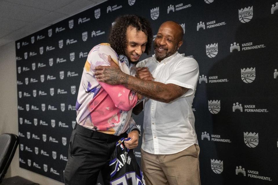 Sacramento Kings 2024 NBA draft pick and Big East Player of the Year from Providence Devin Carter hugs his father Anthony on Tuesday after his introduction.