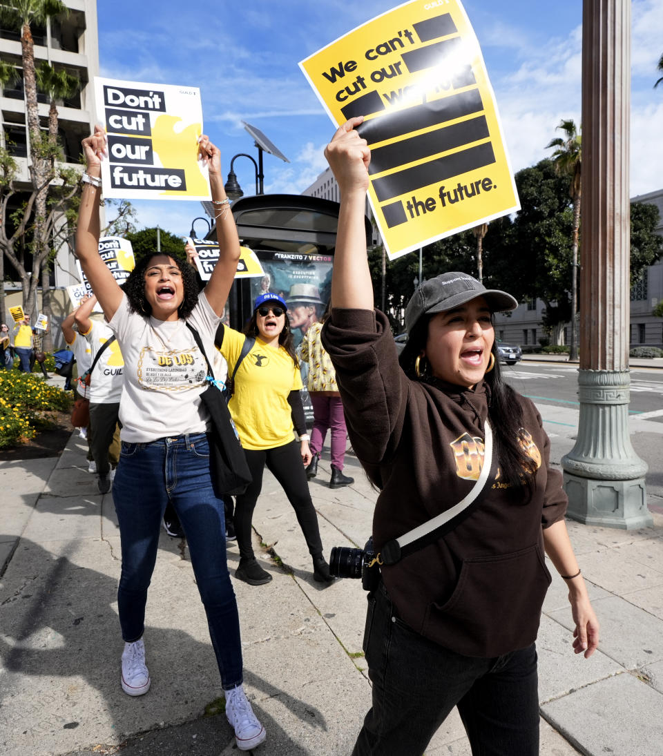 Staff and supporters of the Los Angeles Times carry signs and chant slogans across the street from Los Angeles City Hall during a rally on Friday, Jan. 19, 2024. Guild members of the Los Angeles Times have participated in one-day walkout to protest imminent layoffs. The job action Friday is the first newsroom union work stoppage in the history of the newspaper, which began printing in 1881. (AP Photo/Richard Vogel)