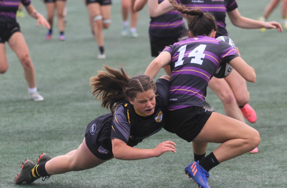 Alexandria Nickel makes a tackle for Warrior Rugby during a 30-0 loss to top-seeded Saint Joseph Academy in the Single School Girls state semifinal at Fortress Obetz on Sunday, May 28, 2023.