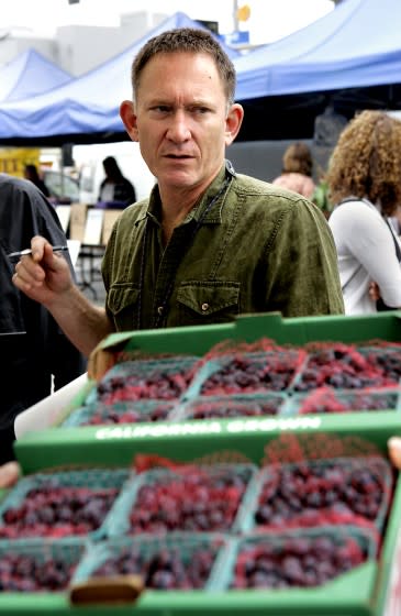 Chef Mark Peel of Campanile shopping for berries at the Santa Monica Farmers Market, Wednesday, May 17, 2006