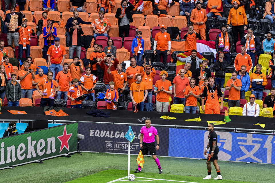 Memphis Depay of the Netherlands prepares to take a corner kick during the Euro 2020 soccer championship group C match between The Netherlands and North Macedonia at the Johan Cruyff ArenA in Amsterdam, Netherlands, Monday, June 21, 2021. (Olaf Kraak, Pool via AP)