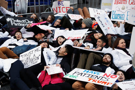 Demonstrators that include mostly medical students protest a proposed repeal of the Affordable Care Act in New York, U.S., January 30, 2017. REUTERS/Lucas Jackson