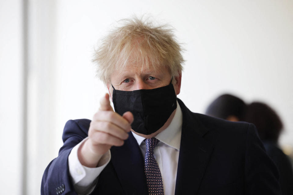 Britain's Prime Minister Boris Johnson, wearing a face covering due to Covid-19, gestures as he takes part in a science lesson at King Solomon Academy in London, on April 29, 2021. (Photo by Dan Kitwood / POOL / AFP) (Photo by DAN KITWOOD/POOL/AFP via Getty Images)