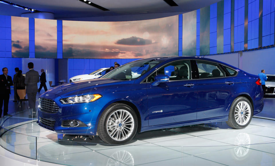 Later this year, Ford Motor Co. will launch this: the 2013 Ford Fusion midsize sedan in three variations — including a plug-in hybrid that gets 100 mpg, besting every other liquid-powered vehicle for sale to the American public. It could be a winning equation, but there's a few key variables Ford hasn't revealed. The current Fusion has turned into a mainstay of Ford's lineup, and the most popular car built by an American automaker, with sales ... more Later this year, Ford Motor Co. will launch this: the 2013 Ford Fusion midsize sedan in three variations — including a plug-in hybrid that gets 100 mpg, besting every other liquid-powered vehicle for sale to the American public. It could be a winning equation, but there's a few key variables Ford hasn't revealed. The current Fusion has turned into a mainstay of Ford's lineup, and the most popular car built by an American automaker, with sales ... more Later this year, Ford Motor Co. will launch this: the 2013 Ford Fusion midsize sedan in three variations — including a plug-in hybrid that gets 100 mpg, besting every other liquid-powered vehicle for sale to the American public. It could be a winning equation, but there's a few key variables Ford hasn't revealed. The current Fusion has turned into a mainstay of Ford's lineup, and the most popular car built by an American automaker, with sales ... more Later this year, Ford Motor Co. will launch this: the 2013 Ford Fusion midsize sedan in three variations — including a plug-in hybrid that gets 100 mpg, besting every other liquid-powered vehicle for sale to the American public. It could be a winning equation, but there's a few key variables Ford hasn't revealed. The current Fusion has turned into a mainstay of Ford's lineup, and the most popular car built by an American automaker, with sales hitting 248,067 in 2011. For its redesign, Ford will run the same play it's called on with the smaller Fiesta and Focus −- build one version of the Fusion for sale worldwide, using the Mondeo name in Europe and elsewhere, to lower costs while raising quality. Assembled in Mexico and Michigan, styled in Europe to follow the new Ford global look, two of its three engines will be built in Spain and England.