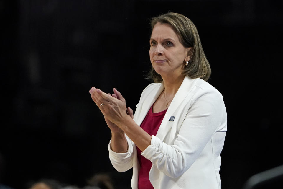 South Dakota head coach Dawn Plitzuweit is seen on the sidelines during the first half of a college basketball game against Michigan in the Sweet 16 round of the NCAA women's tournament Saturday, March 26, 2022, in Wichita, Kan. (AP Photo/Jeff Roberson)