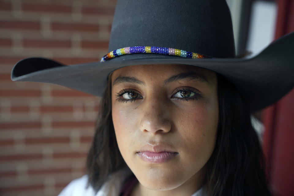 Bull rider Najiah Knight poses during a photo shoot in Fort Worth, Texas, Wednesday, Oct. 4, 2023. Najiah, a high school junior from small-town Oregon, is on a yearslong quest to become the first woman to compete at the top level of the Professional Bull Riders tour. (AP Photo/LM Otero)