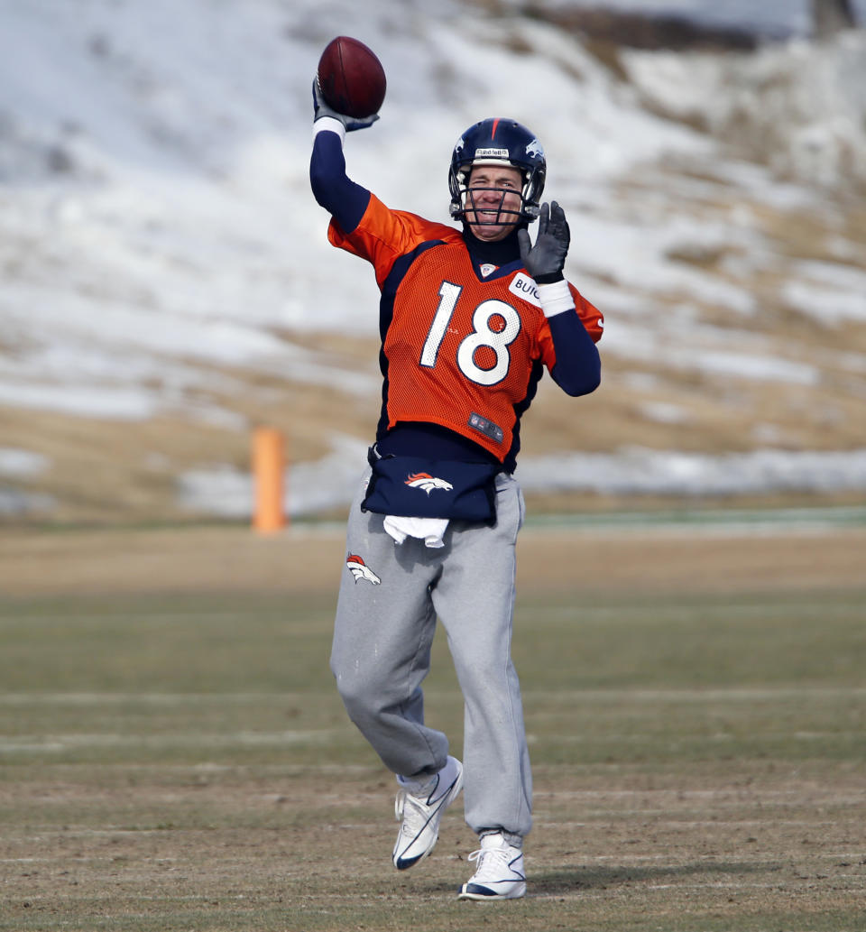 Denver Broncos quarterback Peyton Manning (18) throws during practice for the football team's NFL playoff game against the San Diego Chargers at the Broncos training facility in Englewood, Colo., on Friday, Jan. 10, 2014. (AP Photo/Ed Andrieski)