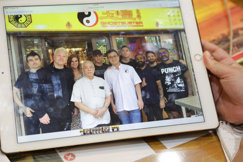 <span>American punk rock band Anti-Flag posing with Chew. (</span>PHOTO: Dhany Osman/Yahoo News Singapore)