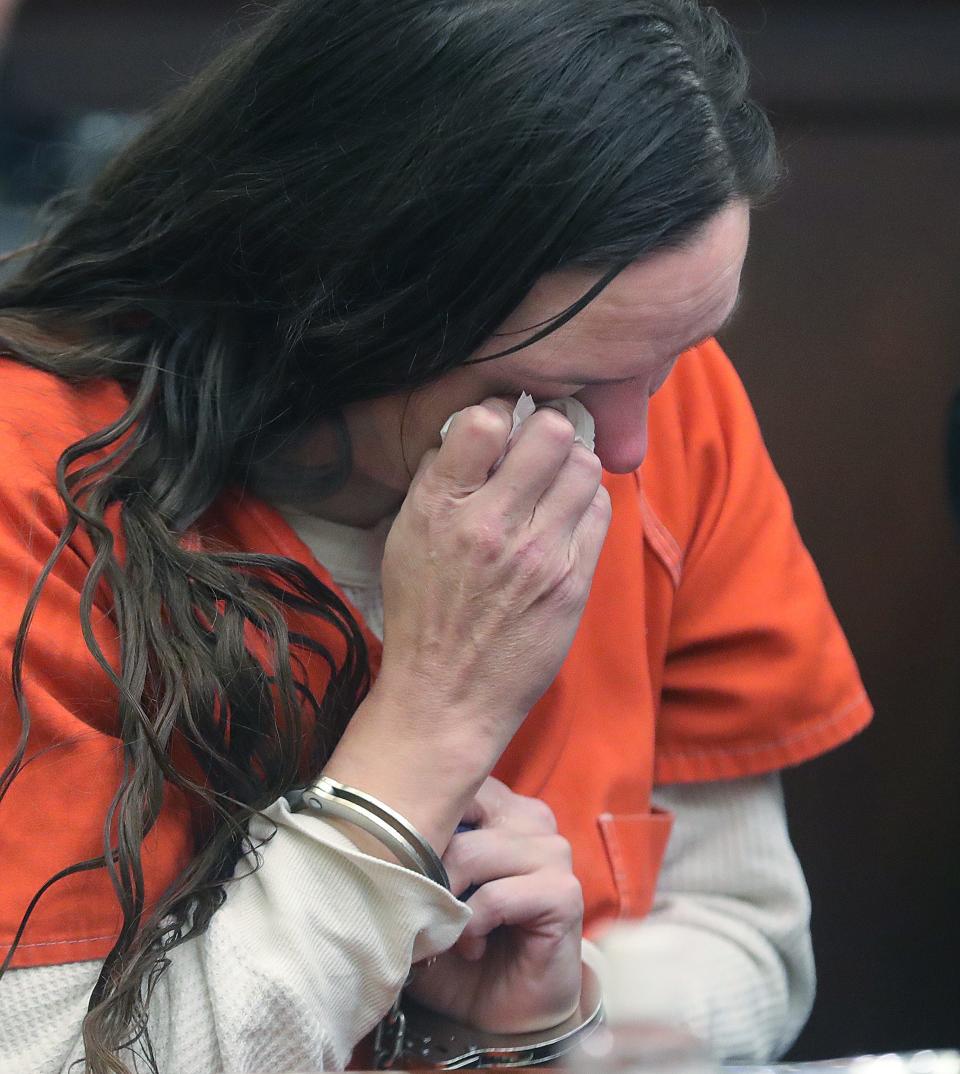 Erica Stefanko wipes away tears while listening to victim impact statements from the family of Ashley Biggs on Thursday in Akron. Stefanko was sentenced by Judge Jennifer Towell to life in prison with a possible parole after 30 years for her role in the 2012 murder of Ashley Biggs.