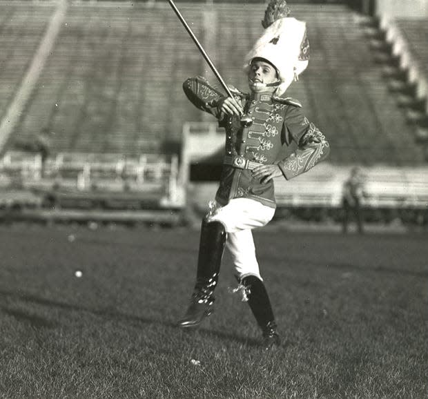 A drum major is shown in the 1936 Ohio State marching band.