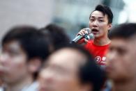 Pro-democratic district councilor-elect Jimmy Sham speaks to supporters at the campus of the Polytechnic University (PolyU) in Hong Kong