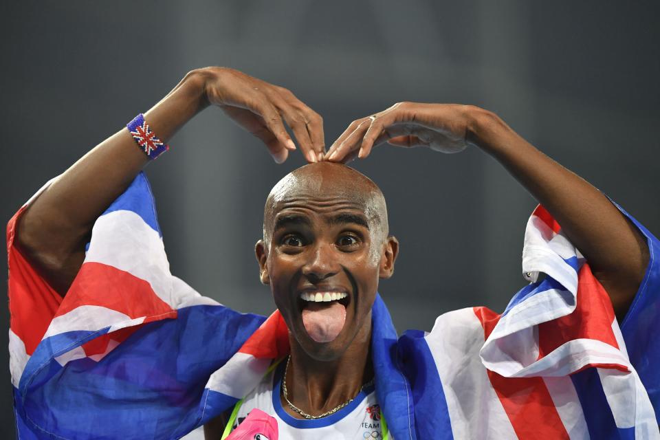 Britain's Mo Farah celebrates after winning the men's 5000m final during the athletics event at the Rio 2016 Olympic Games at the Olympic Stadium in Rio de Janeiro on Aug. 20, 2016. / Credit: Olivier Morin/AFP/Getty