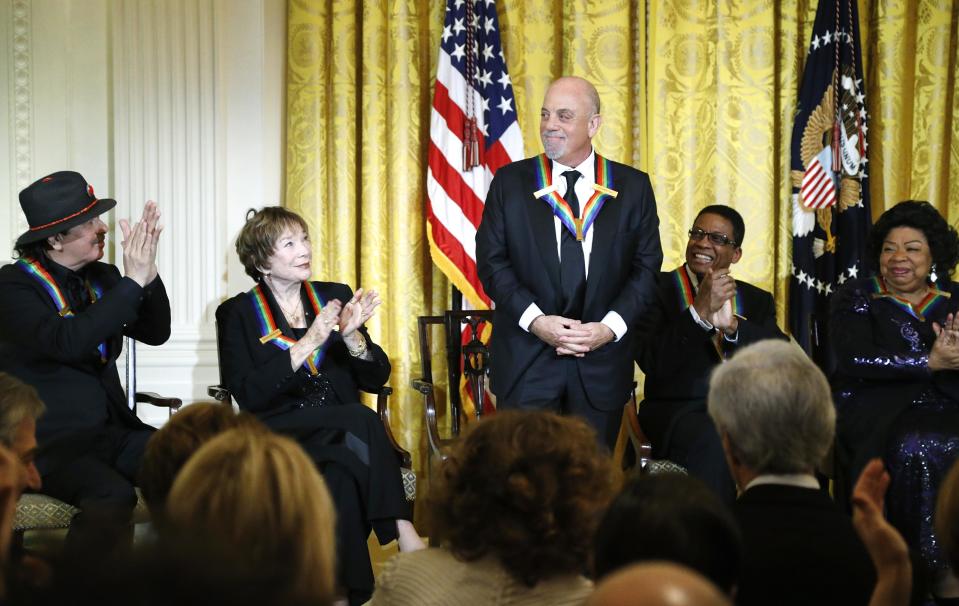 Joel is applauded by his fellow 2013 Kennedy Center Honors recipients during a reception at the White House in Washington