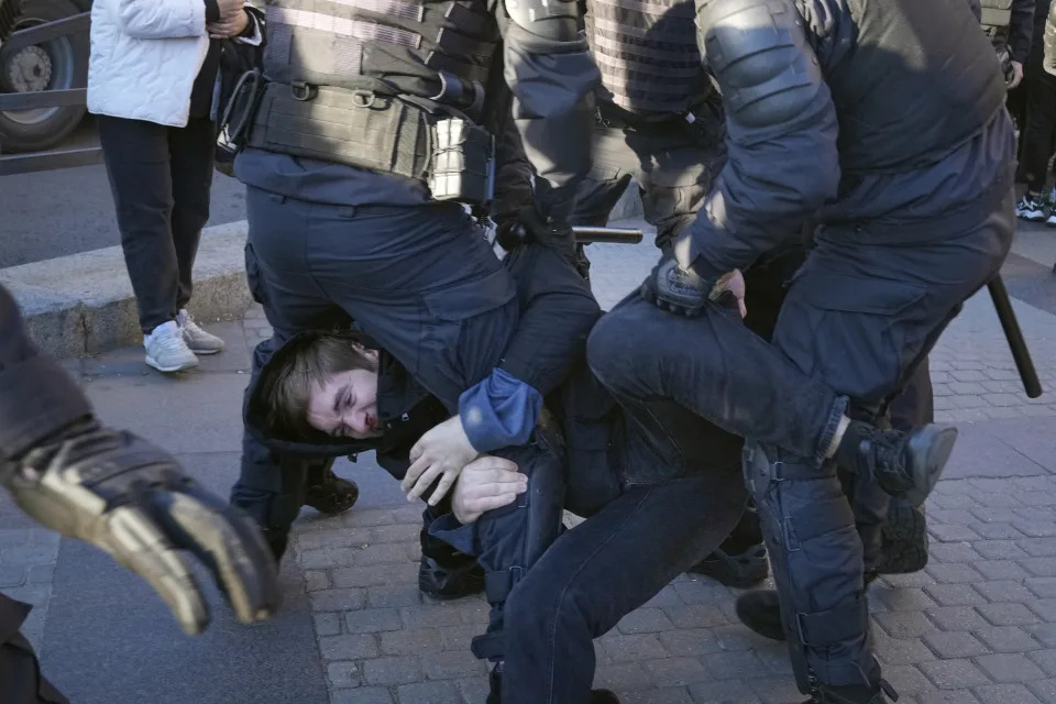 FILE - Russian policemen detain a demonstrator protesting mobilization in St. Petersburg, Russia, Saturday, Sept. 24, 2022. In the last two years, ordinary Russians have been increasingly swept up in an unprecedented government crackdown, together with opposition politicians, independent journalists and human rights activists. (AP Photo, File)