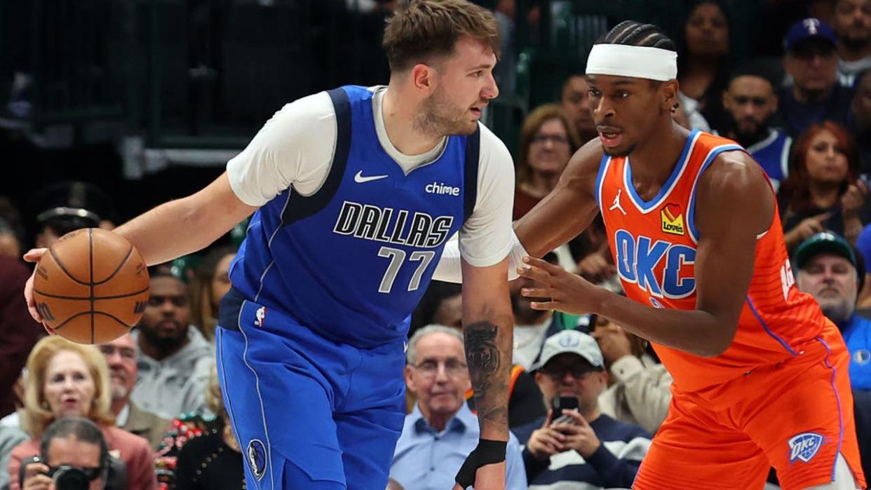 <div>DALLAS, TEXAS - DECEMBER 02: Luka Doncic #77 of the Dallas Mavericks looks for an opening against Shai Gilgeous-Alexander #2 of the Oklahoma City Thunder at American Airlines Center on December 02, 2023 in Dallas, Texas. (Photo by Richard Rodriguez/Getty Images)</div>
