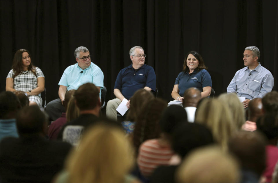 Ann McCormick and other Ford Motor Co. team members speak during a panel discussion on the automaker's planned electric truck factory, at Haywood High School, Tuesday, June 21, 2022, in Brownsville, Tenn. (Patrick Lantrip/Daily Memphian via AP)