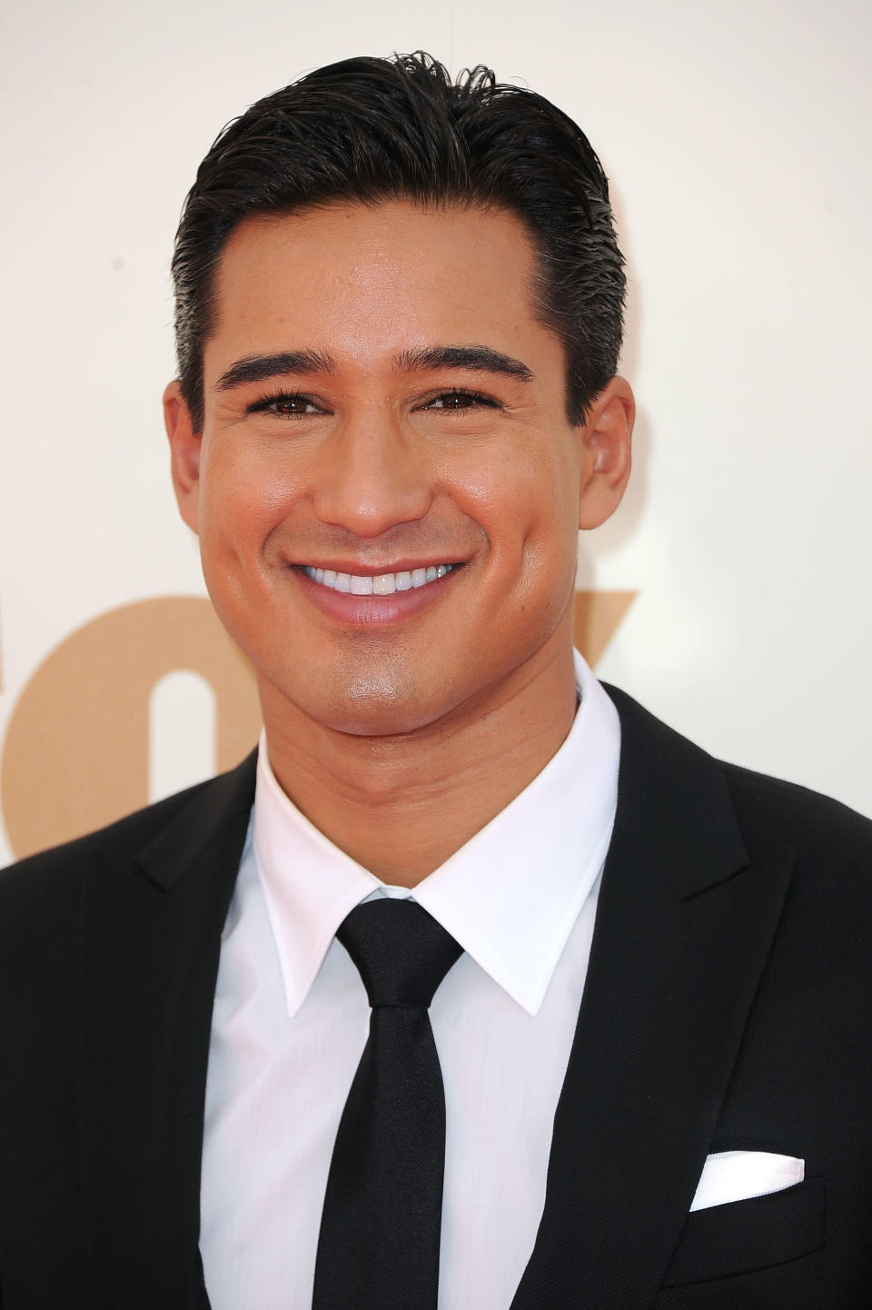 MARIO LOPEZ. Dimples can make a face look younger. Who would have thought actor and TV host Mario Lopez in his late 30s? His bedimpled smile make him look as if he's still the 90s "Saved By The Bell" star fans fell in love with. (Photo by Frazer Harrison/Getty Images)