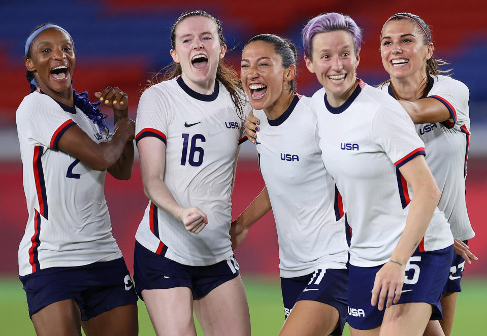 <p>Crystal Dunn, Rose Lavelle, Christen Press, Megan Rapinoe and Alex Morgan of Team USA's women's soccer team celebrate following their team's victory in the penalty shoot-out after their quarterfinal match against the Netherlands on July 30.</p>