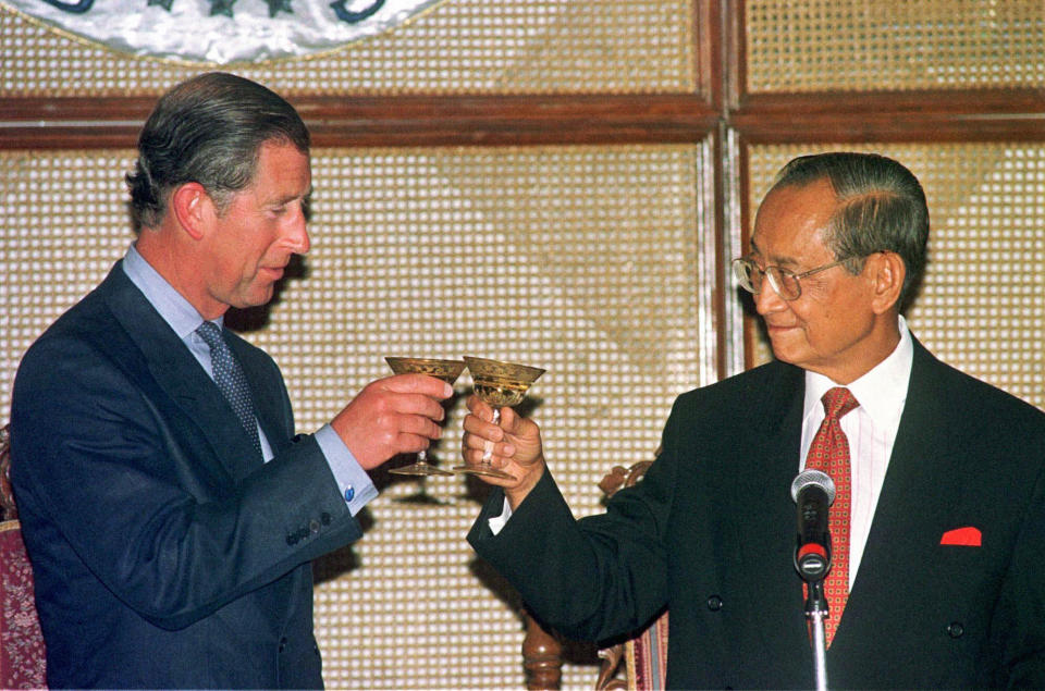 FILE - President Fidel Ramos, right, offers a toast to Prince Charles during a dinner on July 3, 1997, at the Malacanang palace in Manila. Ramos, a U.S.-trained ex-general who saw action in the Korean and Vietnam wars and played a key role in a 1986 pro-democracy uprising that ousted a dictator, has died. He was 94. Some of Ramos's relatives were with him when he died on Sunday, July 31, 2022, said his longtime aide Norman Legaspi. (AP Photo/Pat Roque, File)