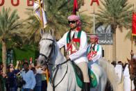 Flagbearers on horseback march as part of the parade. (Photo: Donna.M.Bee.Photography)