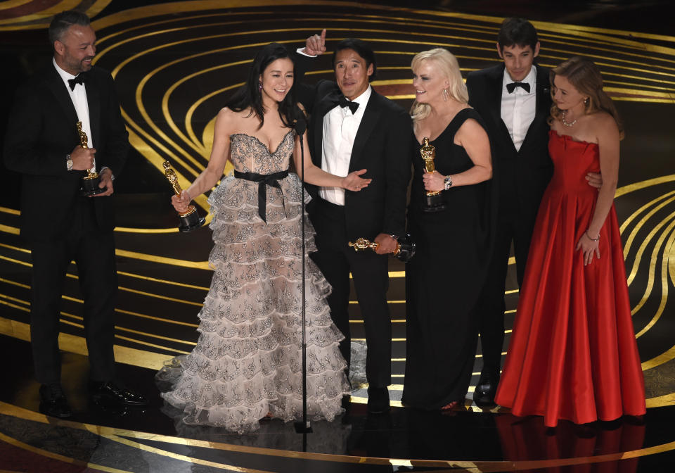 Evan Hayes, from left, Elizabeth Chai Vasarhelyi, Jimmy Chin, Shannon Dill, Alex Honnold, and Sanni McCandless accept the award for best documentary feature for "Free Solo" at the Oscars on Sunday, Feb. 24, 2019, at the Dolby Theatre in Los Angeles. (Photo by Chris Pizzello/Invision/AP)