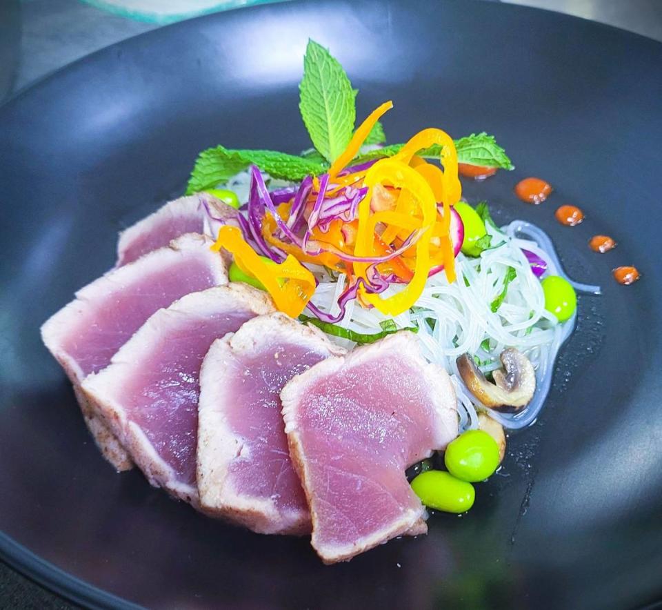 An entree at Crab & Fin for Savor Sarasota Restaurant Week features seared yellowfin tuna, tagarashi, chilled vermicelli, soy vinaigrette, hon himeji mushrooms, sugar snap peas and wasabi pea furikake.