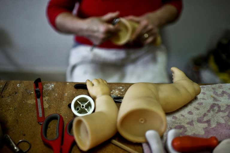 The dolls are given a patient file and are painstakingly restored by three women "doctors"