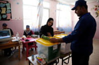 A Jordanian woman casts her ballot at a polling station for local and municipal elections in Amman, Jordan, August 15, 2017. REUTERS/Muhammad Hamed