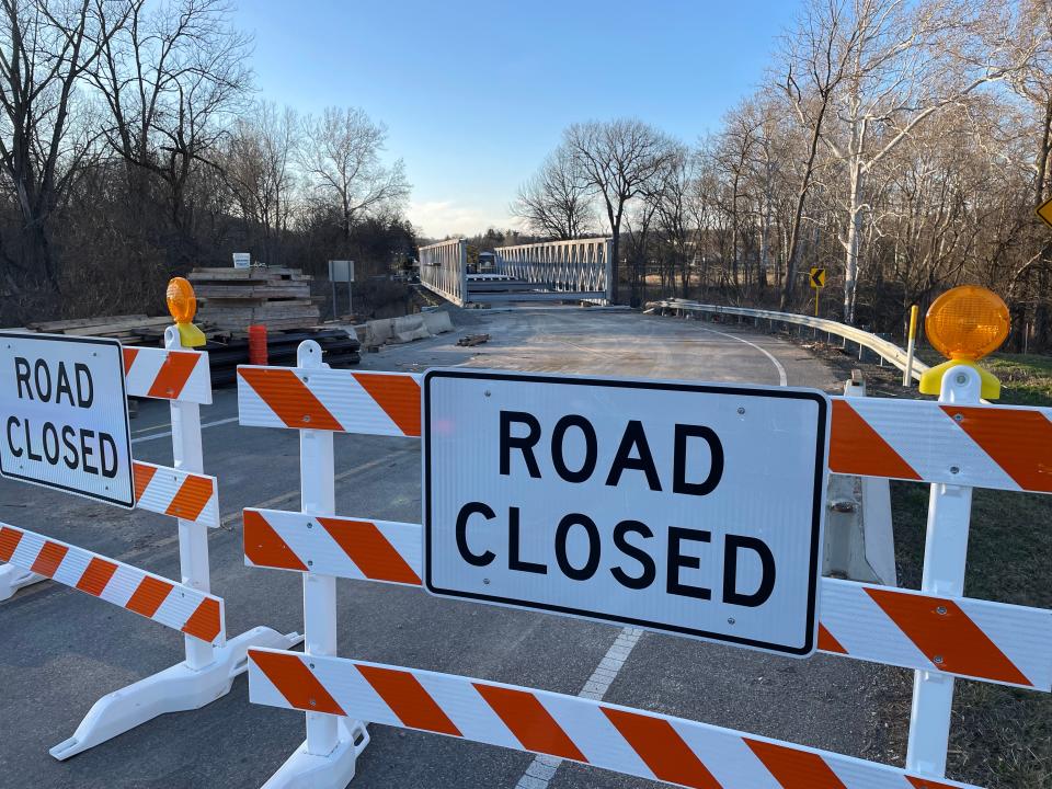 Construction crews built reinforced concrete and steel supports at each end of the 190-year-old Showman Arch Bridge, seen here in early March, to hold the temporary bridge that is expected to open at the end of April.