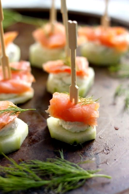 <p>Baker By Nature</p><p>Livened up with a zingy horseradish and dill cream cheese, these simple yet fancy bites are crunchy, creamy finger food perfection.</p><p><strong>Get the recipe: <a href="https://bakerbynature.com/smoked-salmon-cream-cheese-cucumber-bites/" rel="nofollow noopener" target="_blank" data-ylk="slk:Smoked Salmon Cream Cheese Cucumber Bites;elm:context_link;itc:0;sec:content-canvas" class="link ">Smoked Salmon Cream Cheese Cucumber Bites</a></strong></p>