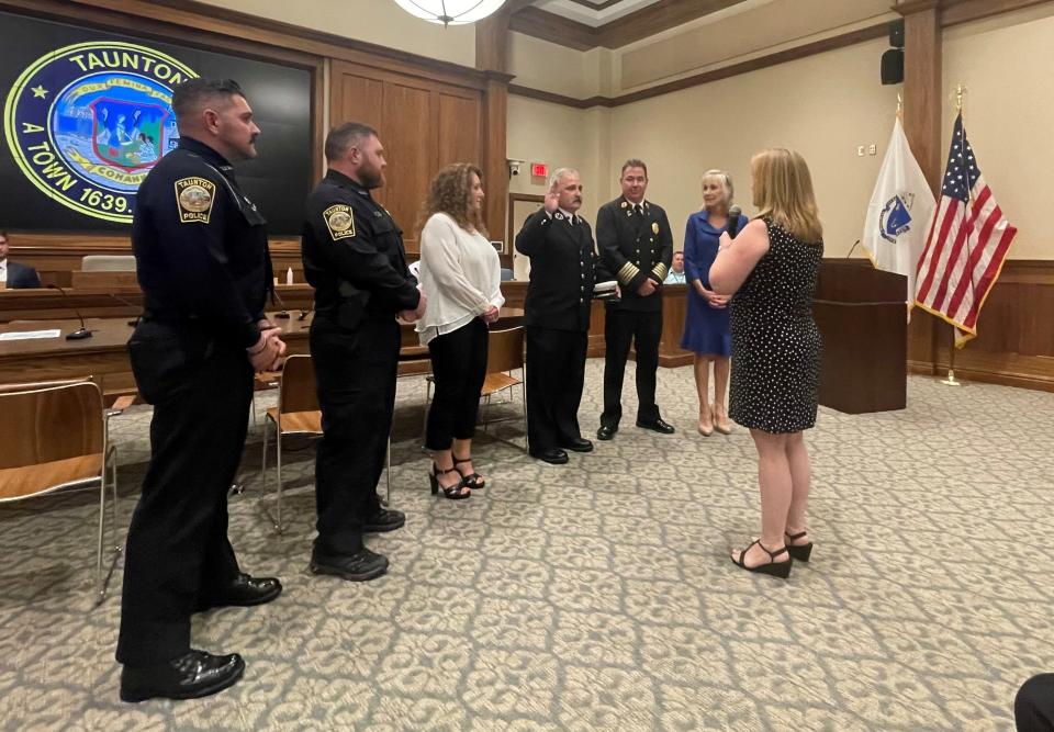 New Taunton Fire Chief Steven Lavigne is sworn in Tuesday, Aug. 8, 2023. By his side are sons Evan Lavigne and Seth Lavigne, both Taunton Police officers, wife Kimberly Lavigne, retiring Fire Chief Timothy Bradshaw and Mayor Shaunna O' Connell.