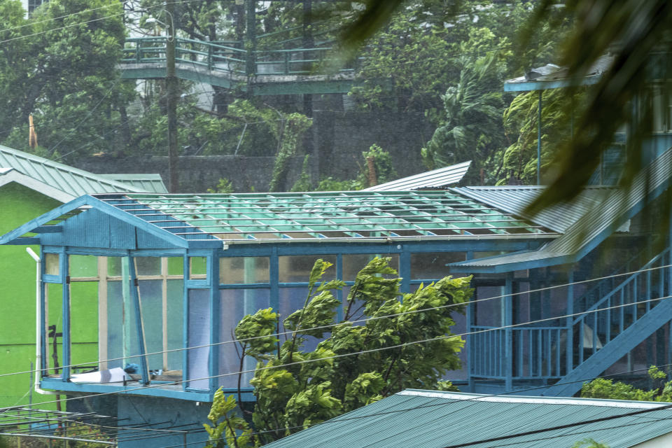 Wind blows past a house whose roof blew away during Hurricane Beryl in Kingstown, St. Vincent and the Grenadines, Monday, July 1, 2024. (AP Photo/Lucanus Ollivierre)