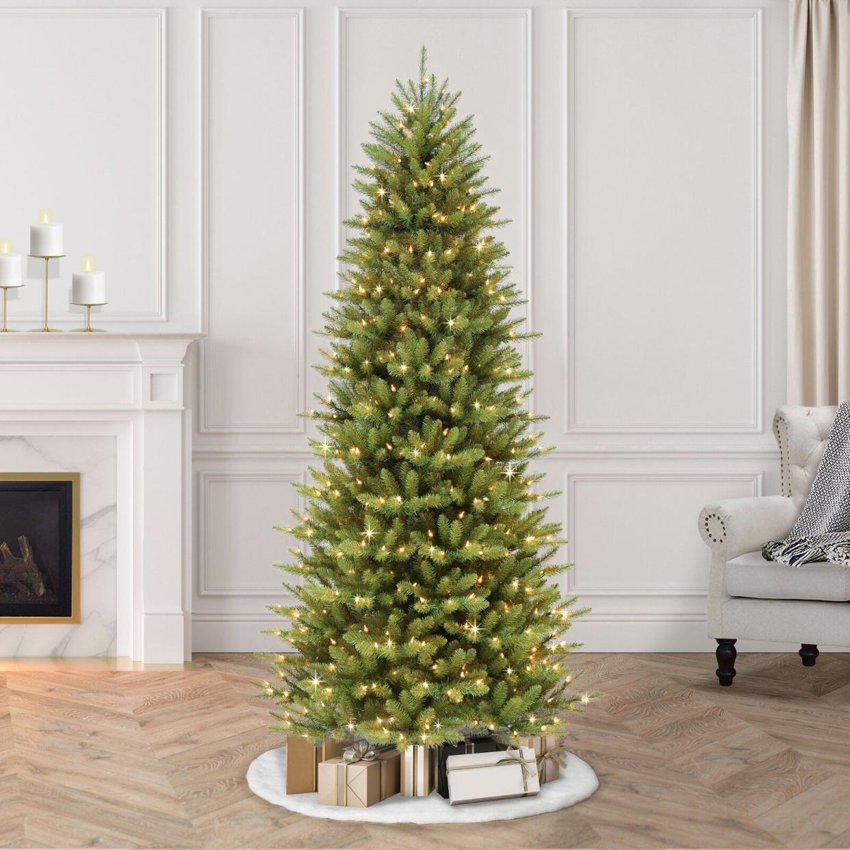 <p><a href="https://go.redirectingat.com?id=74968X1596630&url=https%3A%2F%2Fwww.wayfair.com%2Fholiday-decor%2Fpdp%2Fandover-mills-slender-green-realistic-artificial-fir-christmas-tree-w006831500.html&sref=https%3A%2F%2F" rel="nofollow noopener" target="_blank" data-ylk="slk:Shop Now;elm:context_link;itc:0;sec:content-canvas" class="link rapid-noclick-resp">Shop Now</a></p><p>7.5' Lighted Artificial Fir Christmas Tree</p><p>wayfair.com</p><p>$189.99</p>